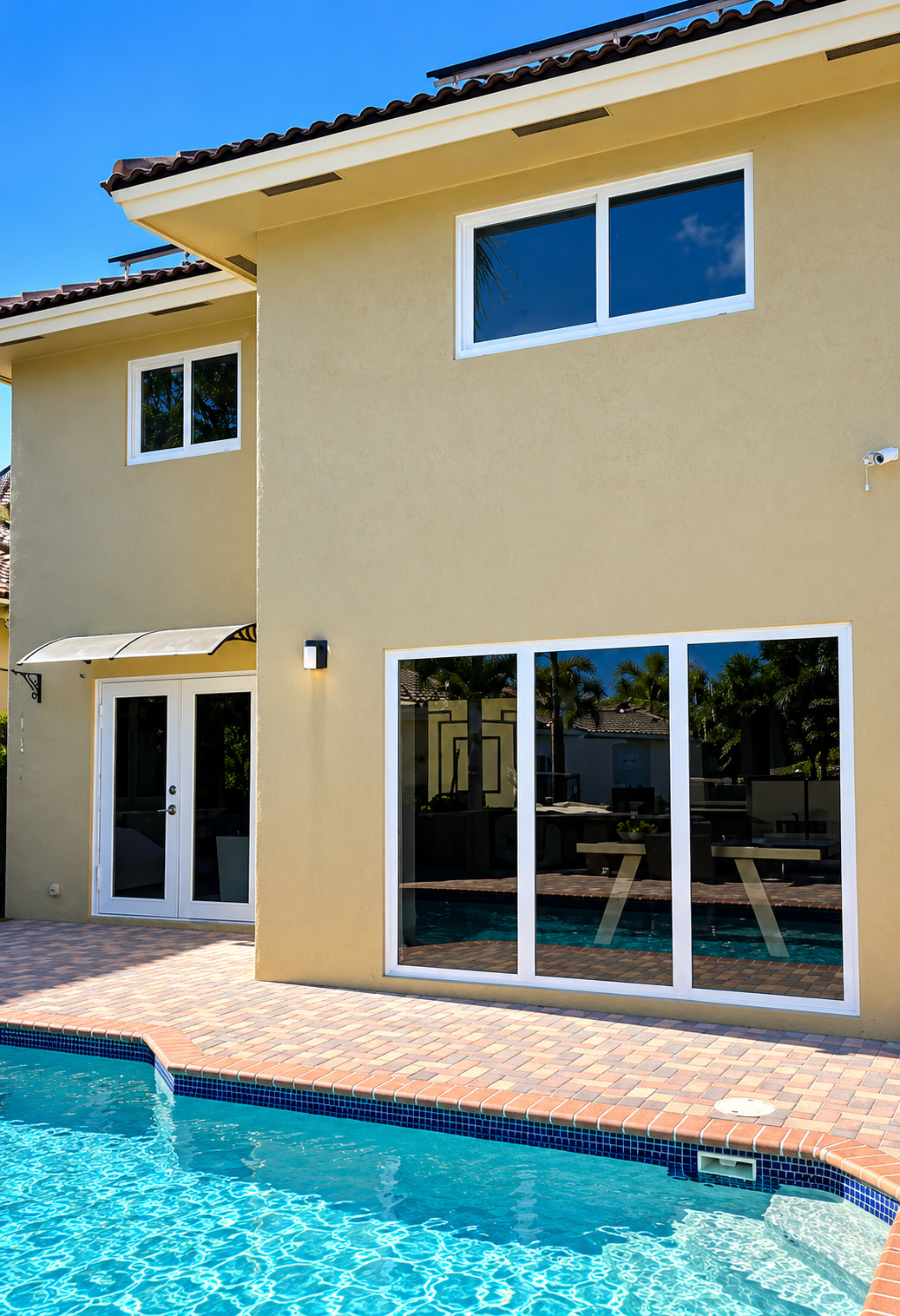 Tile roof edge and fascia meeting a limestone facade, design visual